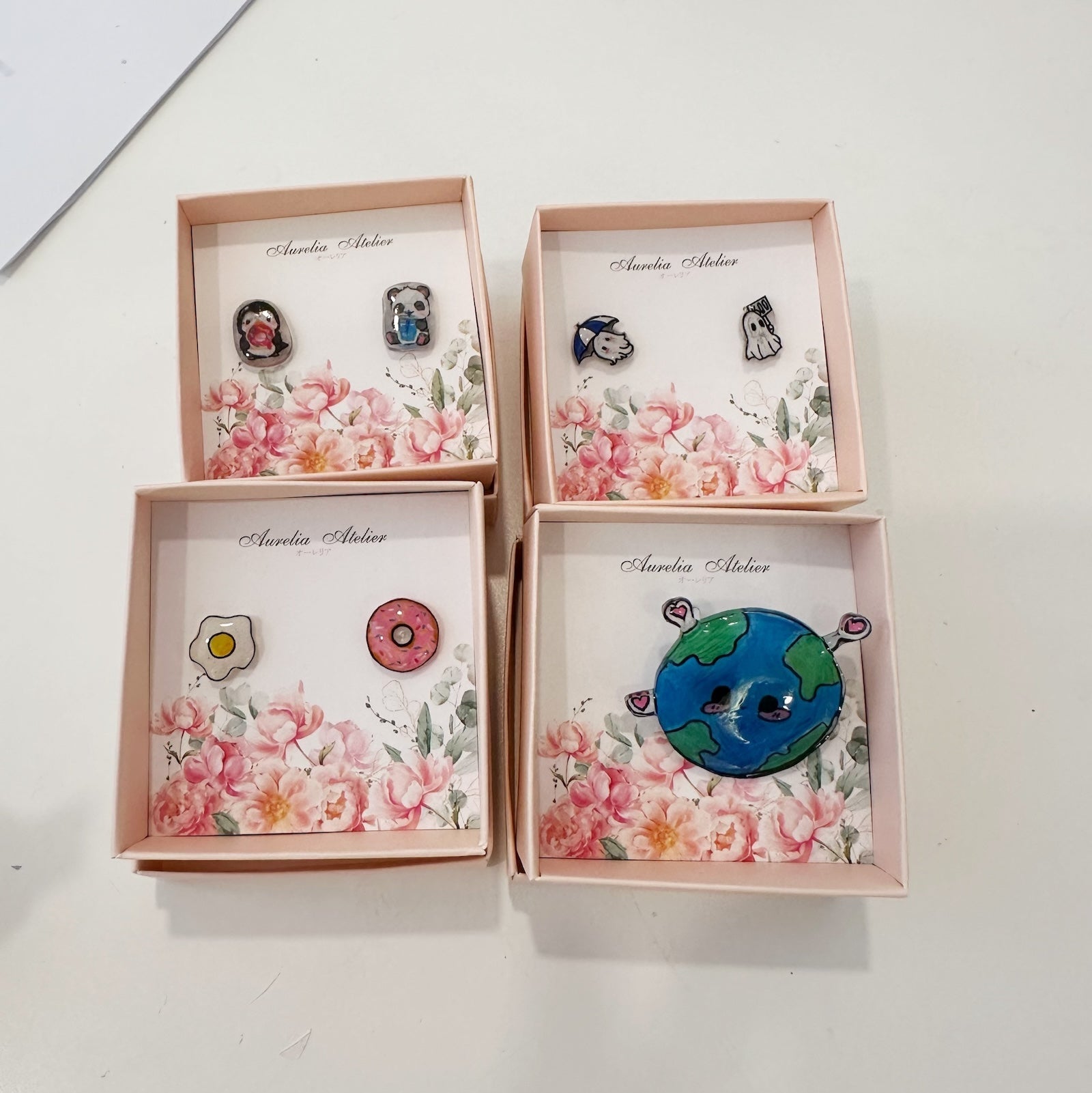 Hands-on creativity at our cozy Korean Jewelry Cafe! Dive into a fun shrink paper jewelry workshop, surrounded by warm ambiance, delicate jewelry tools, and creative energy. Perfect for crafting enthusiasts looking to make something unique! coffee cafe earrings jewelry making weekend workshop