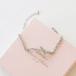Silver Dear Love Ribbon Bracelet with pavé cubic zirconia bow design, 925 sterling silver rhodium plated, by Aurelia Atelier, IU, perfect crown, kdrama earrings, chanel earrings, ruban, 蝴蝶结耳环，镶嵌密钉立方氧化锆，925纯银镀铑, 