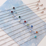 Silver bracelets with colorful beads on a blue card with 'Merry Christmas' text. Gift set for her / hadiah untuk wanita / 送给她的礼物。Perfect for best friend / sahabat baik / 最好的朋友。Includes beloved earrings, bracelet, and ring / 心爱的耳环、手链和戒指。Made in Korea / 制造于韩国 / buatan Korea. Dainty jewellery / 简约精致首饰 / barang kemas halus. 925 sterling silver / 925纯银 / perak tulen 925. Anti-tarnish / 防氧化 / tahan karat. Suitable for daily wear / 适合日常佩戴 / sesuai untuk dipakai setiap hari/ blind box / plushie / toy / christmas